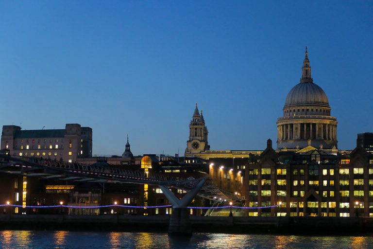 Looking across the Thames and Millennium Bridge to St Paul's Cathedral at night. Discover unusual London tours, guaranteed to make your time in the city special.