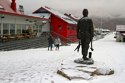 Town centre of Longyearbyen, with a sprinkling of snow. Discover how to plan a budget trip to Svalbard.