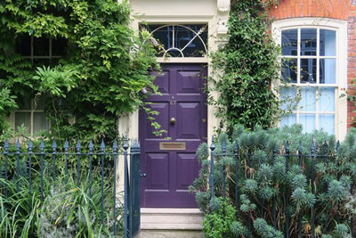 A purple front door in Bermondsey. Find out everything you need to know before moving to London.