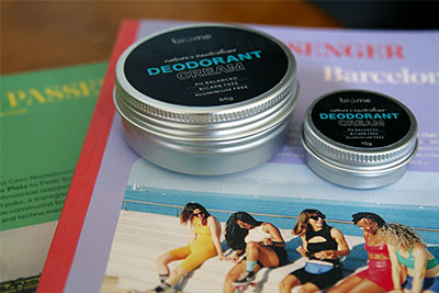 Biome deodorant containers on top of Passenger publications